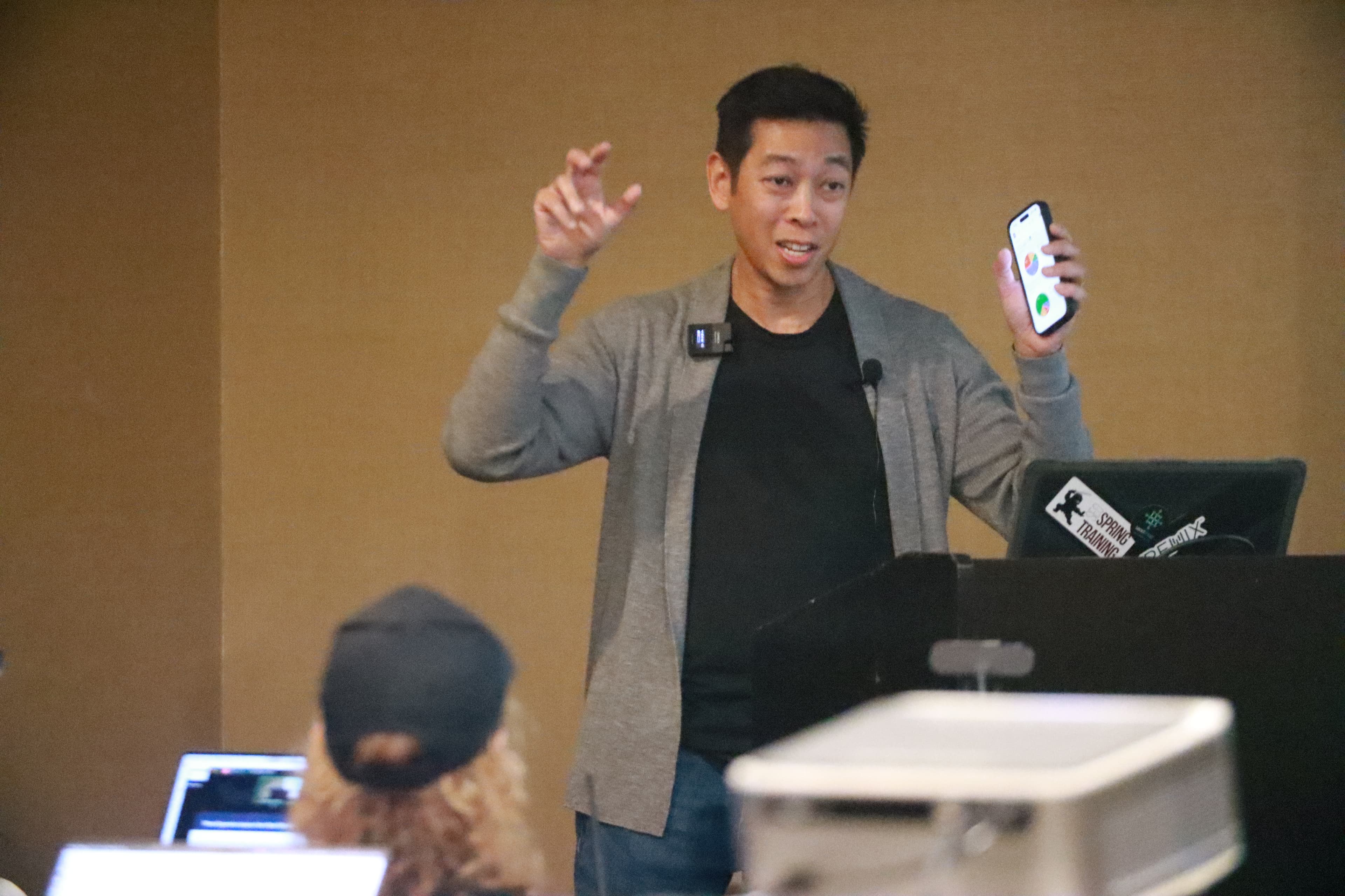 Speaker presenting with energy at SEO Rockstars